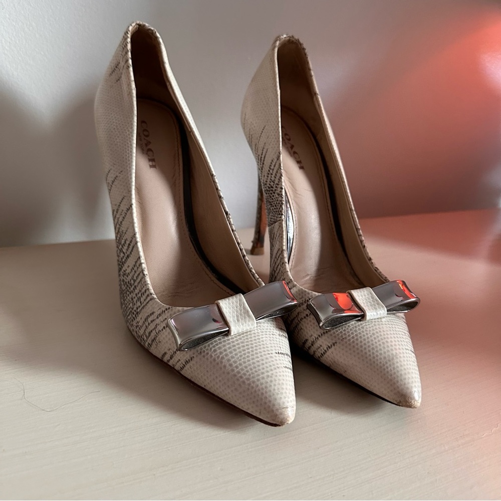 Coach - snakeskin heels with metallic bow accent